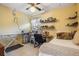 Spare bedroom with sewing station and ceiling fan at 6908 Mesa Verde St, Port Richey, FL 34668