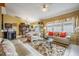 Bright living room with tile flooring, a ceiling fan, and plush seating arrangement at 6908 Mesa Verde St, Port Richey, FL 34668