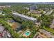 Aerial view of community near lush trees, pool, and waterfront at 701 S Madison Ave # 505, Clearwater, FL 33756