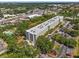 An aerial view of the residential building, parking lot, and green spaces at 701 S Madison Ave # 505, Clearwater, FL 33756