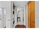 Hallway with in-unit laundry and storage leads to ensuite bathroom at 701 S Madison Ave # 505, Clearwater, FL 33756