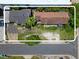 Aerial view of the property highlighting the layout, landscaping, and proximity to the street at 703/709 Patterson St, Clearwater, FL 33756