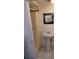 Functional bathroom with a pedestal sink, walk-in shower, and Starry Night mirror at 703/709 Patterson St, Clearwater, FL 33756