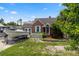 Charming home with a well-manicured lawn, white picket fence and boat in the driveway at 703/709 Patterson St, Clearwater, FL 33756