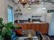 Bright kitchen area featuring wood cabinets, tile backsplash and stainless steel appliances at 703/709 Patterson St, Clearwater, FL 33756