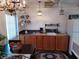 Bright kitchen area featuring wood cabinets, tile backsplash and stainless steel appliances at 703/709 Patterson St, Clearwater, FL 33756