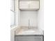 Bathroom vanity featuring granite countertops, modern faucet, and white cabinets for ample storage at 705 3Rd Ne Ave, Largo, FL 33770