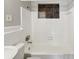 Clean bathroom with white tiled walls, a toilet and sink at 705 3Rd Ne Ave, Largo, FL 33770