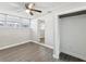 This bedroom features neutral walls, hardwood floors, and a ceiling fan for a comfortable living space at 705 3Rd Ne Ave, Largo, FL 33770