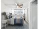 Beautiful bedroom with a large decorative bed, side table, and overhead fan at 705 3Rd Ne Ave, Largo, FL 33770