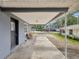 Covered patio area showing a black door and a partial street view at 705 3Rd Ne Ave, Largo, FL 33770