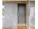 Exterior entrance featuring a welcome mat and a screen door at 705 3Rd Ne Ave, Largo, FL 33770