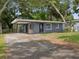 Charming single-story home with a carport and well-maintained front yard at 705 3Rd Ne Ave, Largo, FL 33770