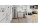 Well-equipped kitchen with granite counters, stainless steel appliances and gray flooring at 705 3Rd Ne Ave, Largo, FL 33770