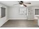 Open concept kitchen with gray flooring, ceiling fan and pantry style cabinets at 705 3Rd Ne Ave, Largo, FL 33770