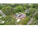 Birds-eye view of a house, pool, yard, surrounded by lush trees at 807 E Chapman Rd, Lutz, FL 33549