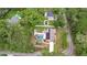 Aerial shot of a home with a pool, solar panels, and spacious yard at 807 E Chapman Rd, Lutz, FL 33549