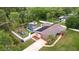 This beautiful home features mature landscaping, solar panels, a pool, and a playground at 807 E Chapman Rd, Lutz, FL 33549