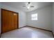 Bedroom featuring a ceiling fan, window for natural light, and closet for storage at 807 E Chapman Rd, Lutz, FL 33549