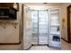 Stainless steel refrigerator with side-by-side doors, open to reveal ample storage space and organization at 807 E Chapman Rd, Lutz, FL 33549