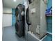 Laundry area featuring new gray stacked washer and dryer units at 807 E Chapman Rd, Lutz, FL 33549