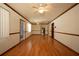 Large living room featuring hardwood floors and decorative glass entry door at 807 E Chapman Rd, Lutz, FL 33549
