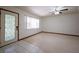 Open living room featuring a glass door and a ceiling fan at 807 E Chapman Rd, Lutz, FL 33549