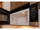 Close-up of a modern microwave featuring easy-to-use controls and a sleek design at 807 E Chapman Rd, Lutz, FL 33549