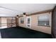 Relaxing screened patio features ceiling fans, and access door to the yard with a view of the swimming pool from the windows at 807 E Chapman Rd, Lutz, FL 33549