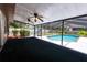 Outdoor pool with screened enclosure, offering a refreshing escape and privacy for leisurely enjoyment at 807 E Chapman Rd, Lutz, FL 33549
