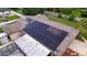 A close up shot of a residential roof featuring a solar panel array at 807 E Chapman Rd, Lutz, FL 33549