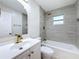 Updated bathroom featuring modern fixtures, vanity, and gray tiled shower and tub at 8375 Burgundy N Dr, Pinellas Park, FL 33781