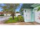 Inviting home exterior with a white front door and landscaped garden, radiating a welcoming atmosphere at 8375 Burgundy N Dr, Pinellas Park, FL 33781