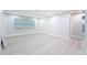 Serene main bedroom with plenty of natural light, complemented by light wood floors and neutral decor at 8375 Burgundy N Dr, Pinellas Park, FL 33781