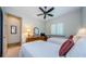 This bedroom features two beds, a ceiling fan, and a dresser for storing your belongings at 1012 Tuscany Dr, Trinity, FL 34655