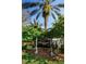 Elegant Champions Club community sign amidst lush landscaping and mature palm trees at 1012 Tuscany Dr, Trinity, FL 34655