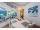 Bright dining area with large windows overlooking the lush backyard at 1012 Tuscany Dr, Trinity, FL 34655