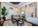 Inviting dining room with a large window, neutral colors, and an elegant chandelier at 1012 Tuscany Dr, Trinity, FL 34655