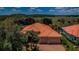Beautiful single-Gathering home featuring a two-car garage, clay tile roof and lush landscaping at 1012 Tuscany Dr, Trinity, FL 34655
