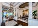 Elegant foyer with hardwood floors, detailed millwork, and views into the dining and living spaces at 1012 Tuscany Dr, Trinity, FL 34655