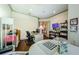 Spacious home office featuring hardwood floors, ample space for crafting, and a television at 1012 Tuscany Dr, Trinity, FL 34655