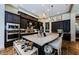 Beautiful kitchen featuring dark wood cabinetry, stainless appliances, and a large island with bar seating at 1012 Tuscany Dr, Trinity, FL 34655