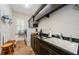 Laundry room with modern washer and dryer units, ample storage and tile floor at 1012 Tuscany Dr, Trinity, FL 34655