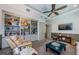 This living room boasts custom built-ins, recessed lighting, and comfortable seating at 1012 Tuscany Dr, Trinity, FL 34655