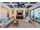 Cozy living room featuring built-in media center, comfortable seating, and access to the lanai at 1012 Tuscany Dr, Trinity, FL 34655