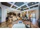 Bright living room with a coffered ceiling and an open layout connecting to the kitchen and entryway at 1012 Tuscany Dr, Trinity, FL 34655