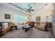 Spacious living room featuring plantation shutters, recessed lighting, and neutral carpet at 1012 Tuscany Dr, Trinity, FL 34655