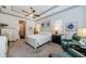 Large main bedroom with sitting area and neutral color scheme at 1012 Tuscany Dr, Trinity, FL 34655