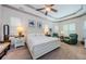 Elegant main bedroom featuring tray ceiling and ample natural light at 1012 Tuscany Dr, Trinity, FL 34655