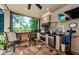Inviting outdoor kitchen featuring a built-in grill and scenic views, perfect for entertaining at 1012 Tuscany Dr, Trinity, FL 34655